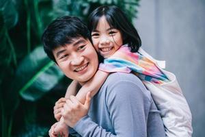 Asian father and daughter at home photo