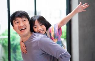 Asian father and daughter at home photo