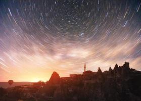 Review unique geological formations in Cappadocia, Picturesque starry sky in Goreme National Park photo