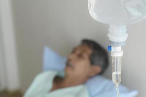 Portrait of senior patient lying on bed in hospital, healthcare and medical concept photo