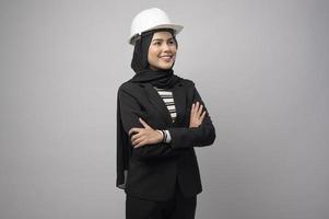 Engineer muslim woman wearing hijab on white background photo