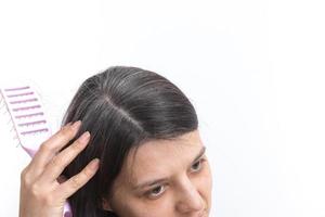 A young woman with gray hair. Early gray hair concept photo