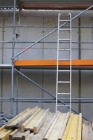 building or construction site with scaffold and ladder photo