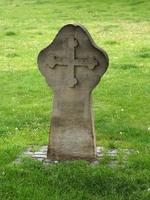 old grave stone with cross photo