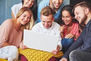 Group of creative young Friends Hanging Social Media Concept. People Together Discussing Creative Project During Work Process, play games or watch video film photo