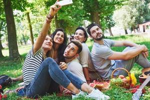 Happy friends having fun outside in nature photo