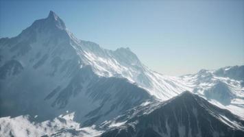 Mountain winter Caucasus landscape with white glaciers and rocky Peak photo