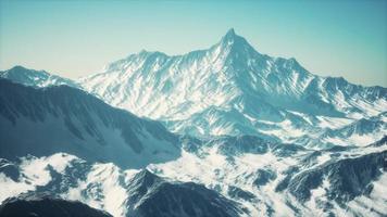 Panoramic view of the ski slope with the mountains photo