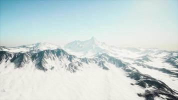 Panoramic view of the ski slope with the mountains photo