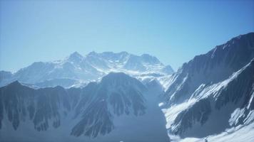 panoramic mountain view of snow capped peaks and glaciers