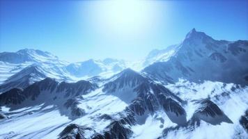 Panoramic view of the ski slope with the mountains photo