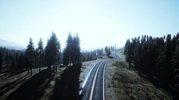 Aerial view of the old road going through pass in the Swiss Alps photo