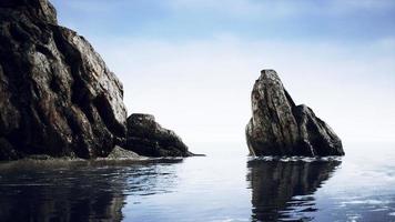 Summer view of sea caves and rock cliffs photo