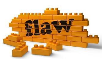 flaw word on yellow brick wall photo