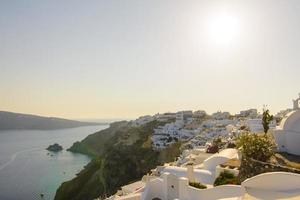 Panorama of the city during sunset in the village of Oia, Santorini. photo