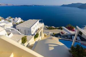 Roof of hotels on the background of the Mediterranean Sea on the island of Santorini, Oia village. photo