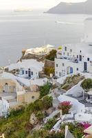 Panorama of the city during sunset in the village of Oia, Santorini. photo