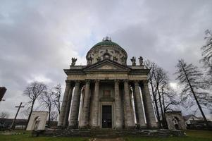 Roman Catholic Church of Saint Joseph. Old historic buildings detail stone wooden sculptures magnificent ornaments lamps street lamps details. Pidhirtsi village, Lviv Oblast, Ukraine OCTOBER 30, 2019 photo