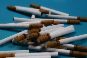 a collection of scattered cigarettes photo