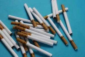 a collection of scattered cigarettes photo