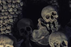 Kutna Hora Church with colonnade of human bones and skulls photo