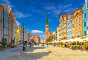 Gdansk cityscape with people tourists walking down Dluga Long Market pedestrian street Dlugi targ square, City Hall