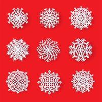 Set of beautiful patterned laser cut snowflakes. Template christmas, new year decorations designs. Elements for the New Year holidays. Vector illustration on a red background