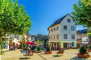 Rudesheim am Rhein, Germany, August 24, 2019 Traditional german houses and beautiful art buildings with typical wooden wall fachwerk style in Rudesheim photo