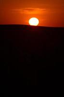 Sun setting on the horizon in Saskatchewan photo