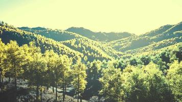 Colorful mountains range in autumn season with red orange and golden foliage video