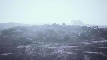 foggy mountain landscape with snow cornice over abyss inside cloud video