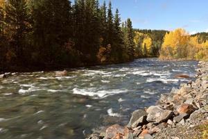 Autumn colors along Northern British Columbia river photo