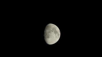 The moon view with the bright moonlight and moon surface at night photo