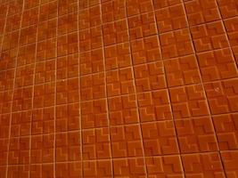 Repetition of a tiled wall in orange photo