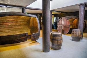 wine barrel in basement cellar of winery