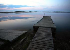 Boat dock at Smallfish Lake in scenic Saskatchewan photo