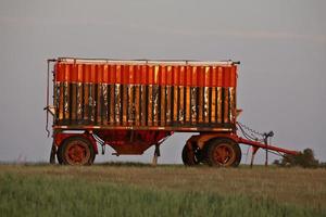 Colorful grain wagon in scenic Saskatchewan photo