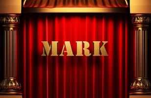 mark golden word on red curtain photo