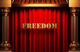 freedom golden word on red curtain photo