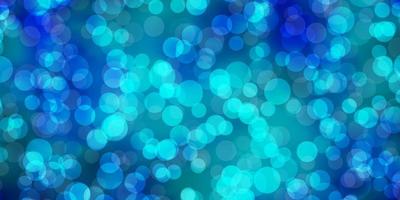 Light BLUE vector background with spots.