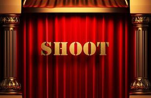 shoot golden word on red curtain photo