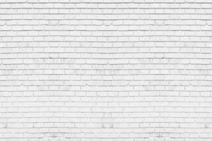 Abstract weathered white brick wall texture background in rural room. Concept horizontal architecture wallpaper photo