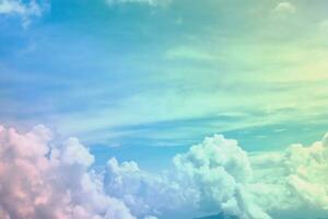 Sunshine clouds sky with a pastel soft color. Abstract blurred cyan gradient of sky nature. photo