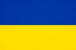 flag of ukraine on leather texture background photo