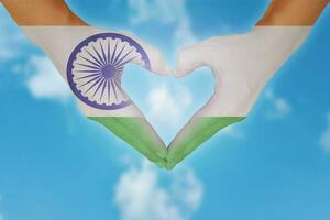 Indian flag painted on hands in heart shaped. photo