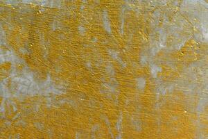 Abstract golden messy wall textured. Gold vintage grunge background.