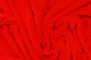 la textura de la tela de seda roja puede usarse como fondo. vista superior. foto