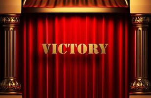 victory golden word on red curtain photo