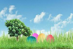 Decorated easter eggs in the grass with blue sky background photo