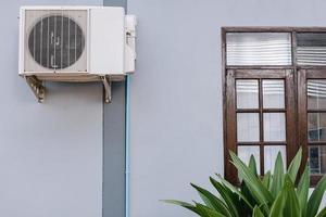 Home Cooling Air Condition Unit and Control System, Air Condenser Engine Station Outside Building of HVAC Systems. Electrical Compressor Fan Coil of Air Conditioning Equipment for Home Residential. photo